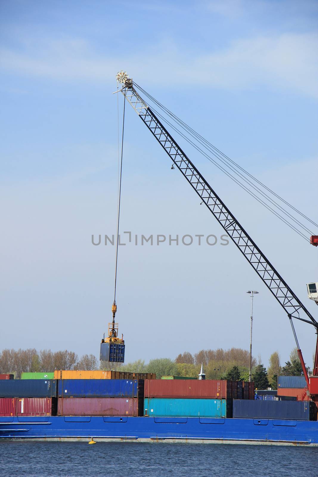 Intermodal containers on a ship, various colors