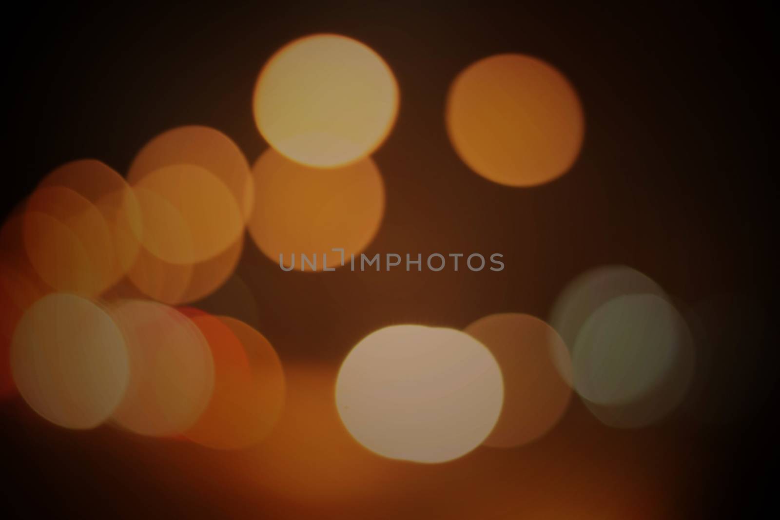 Light orange bokeh background and black coffee.