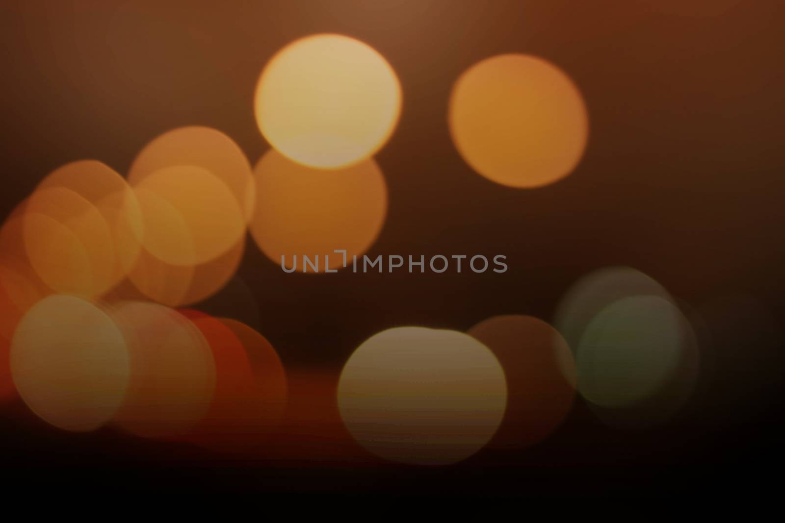 Light orange bokeh background and black coffee.