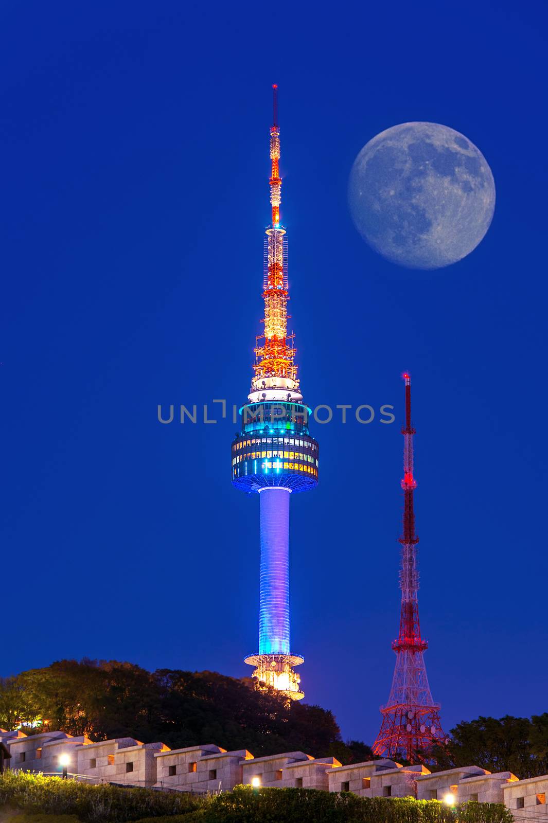 N Seoul Tower with full moon Located on Namsan Mountain in central Seoul,South Korea.