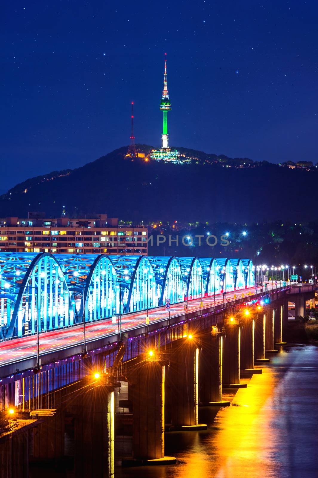 View of downtown cityscape at Dongjak Bridge and Seoul tower over Han river in Seoul, South Korea.