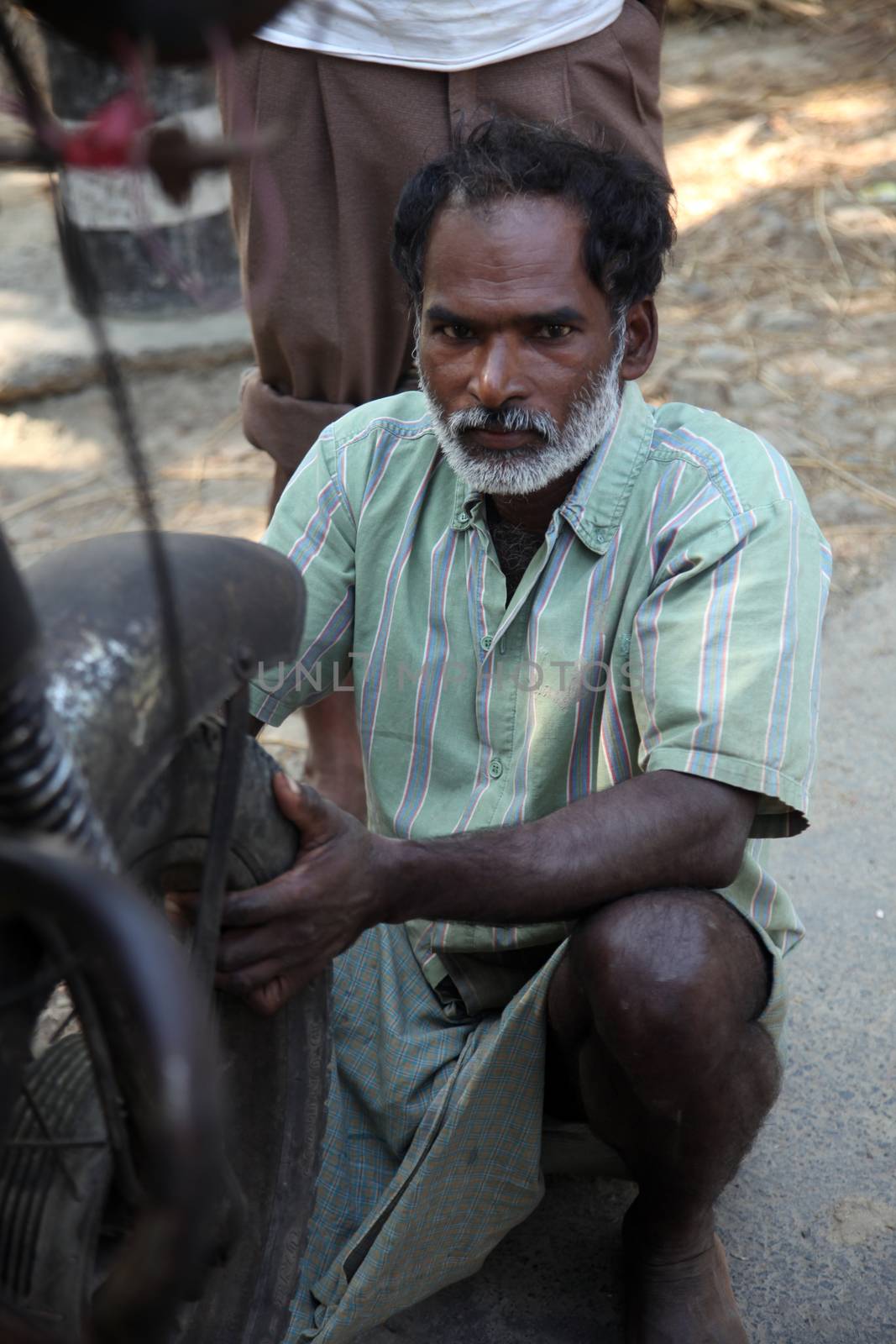 Mechanic repair the motorbike. Bikes is the common individual transport in India.