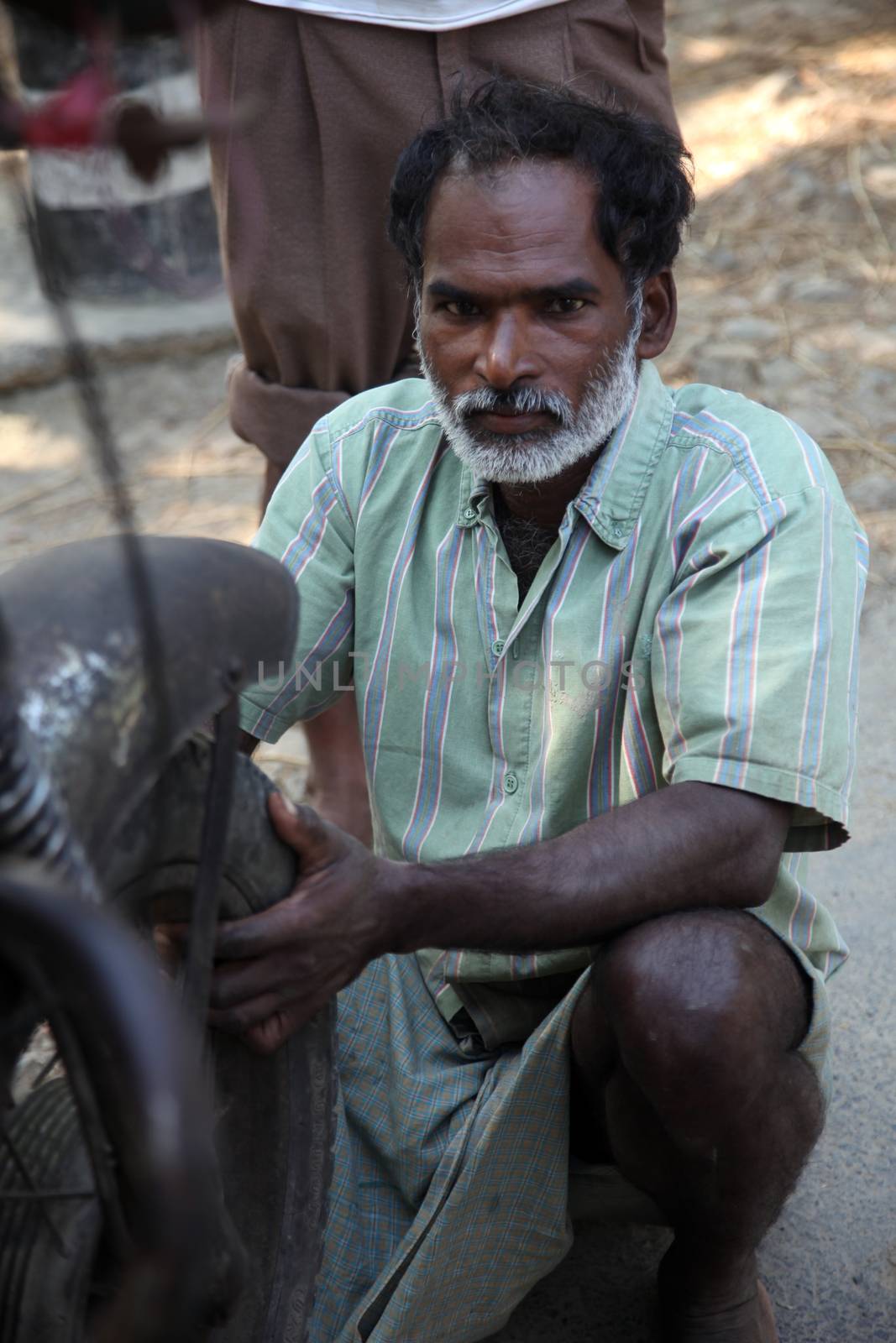 Mechanic repair the motorbike. Bikes is the common individual transport in India.