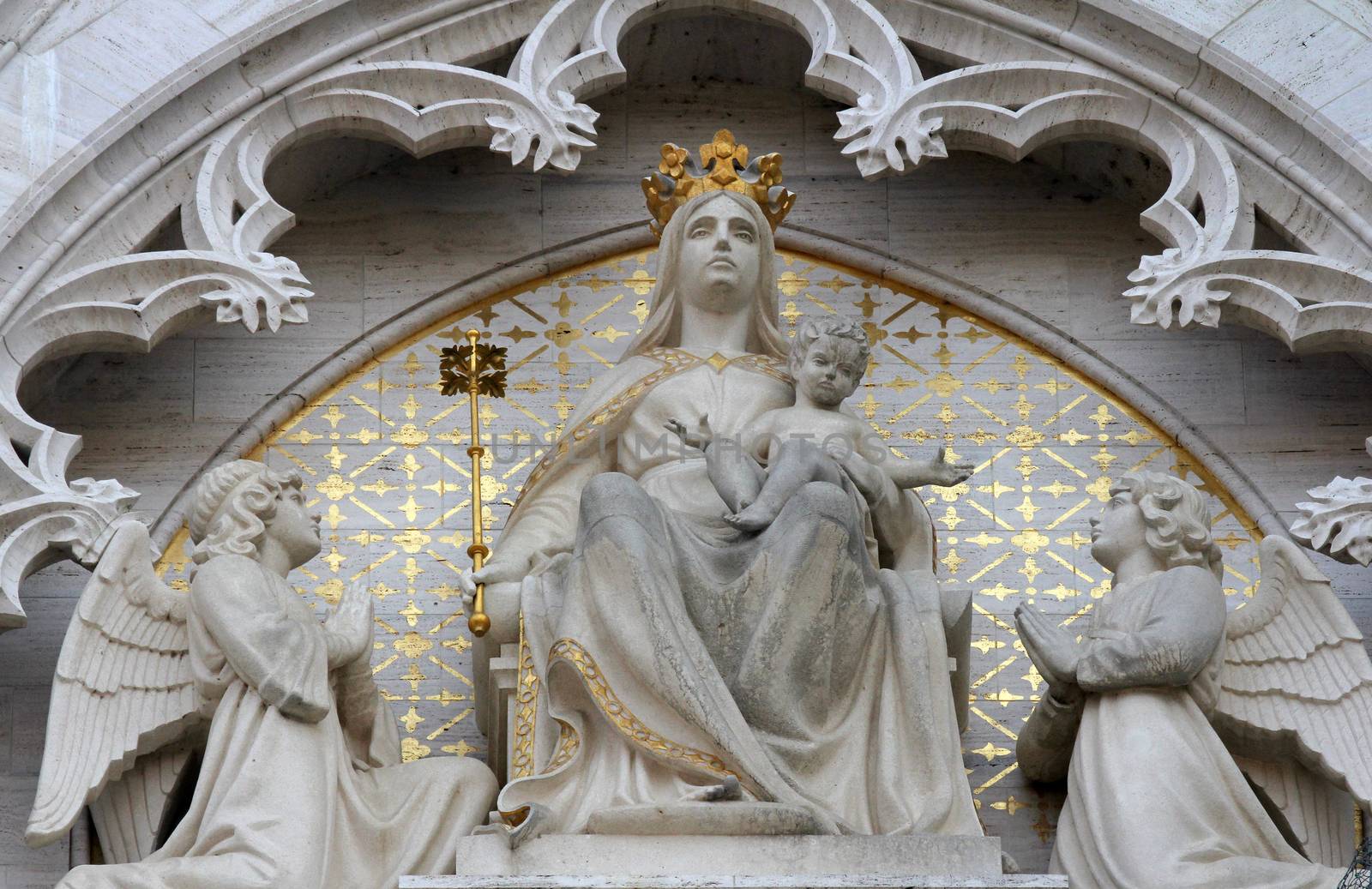 Statue of Madonna on the throne with the Child Jesus and two angels on the portal of the cathedral dedicated to the Assumption of Mary and to kings Saint Stephen and Saint Ladislaus in Zagreb on Sept 26, 2013.