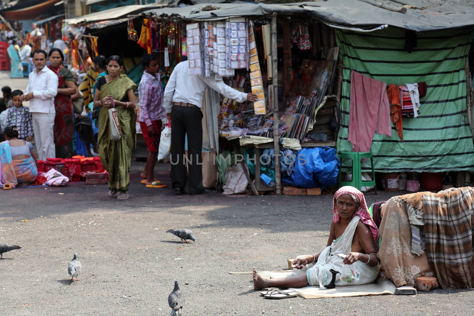 Beggars in front of Nirmal, Hriday, Home for the Sick and Dying Destitutes in Kolkata by atlas