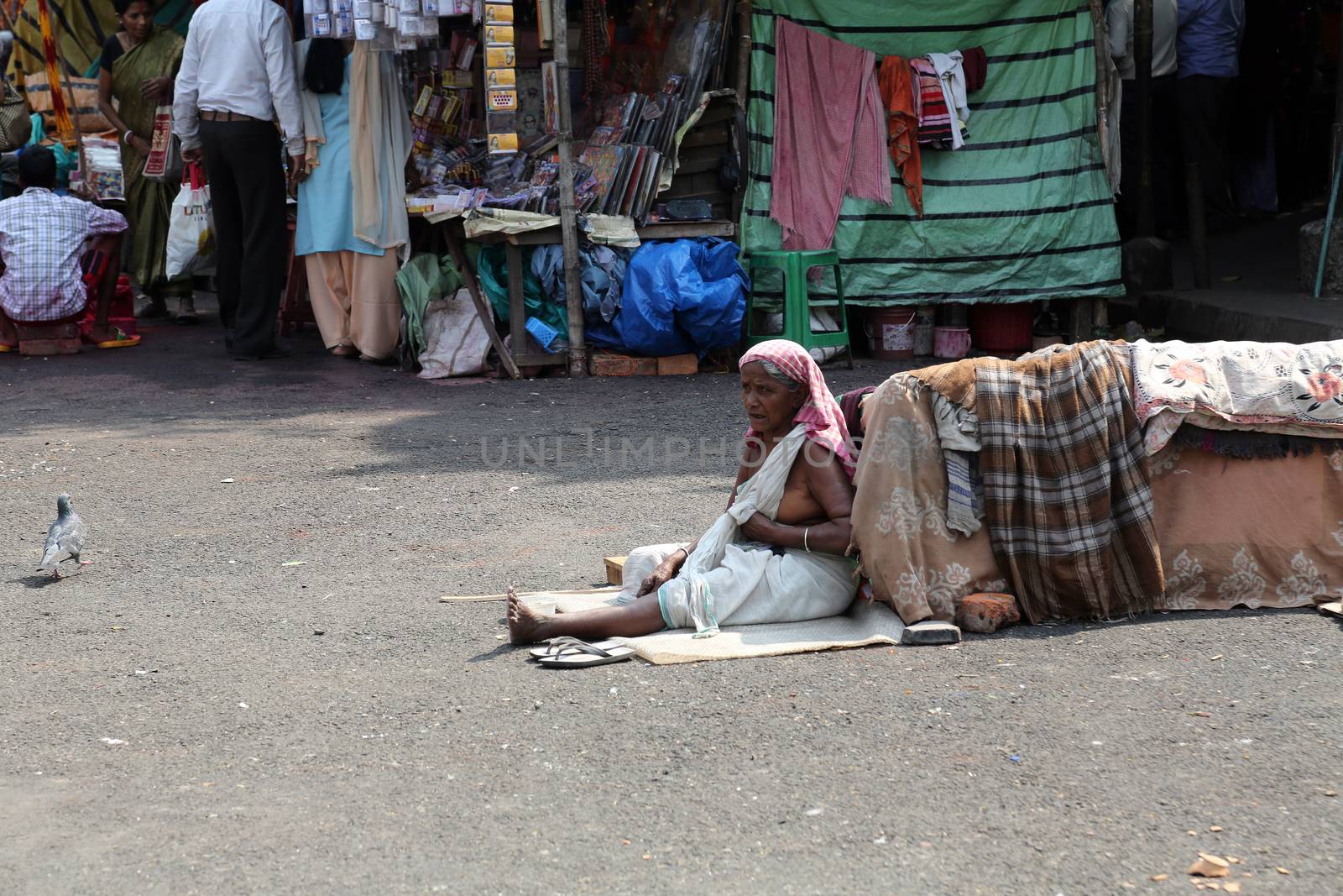 Beggars in front of Nirmal, Hriday, Home for the Sick and Dying Destitutes, one of the buildings established by the Mother Teresa and run by the Missionaries of Charity in Kolkata, India on February 10, 2014.