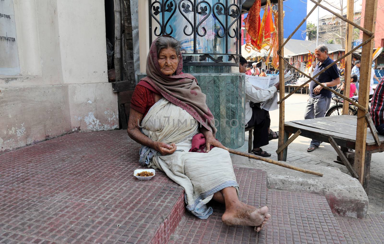 Beggars in front of Nirmal, Hriday, Home for the Sick and Dying Destitutes, one of the buildings established by the Mother Teresa and run by the Missionaries of Charity in Kolkata, India on February 10, 2014.