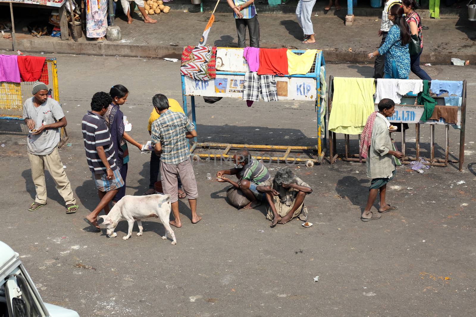 Beggars in front of Nirmal, Hriday, Home for the Sick and Dying Destitutes in Kolkata by atlas
