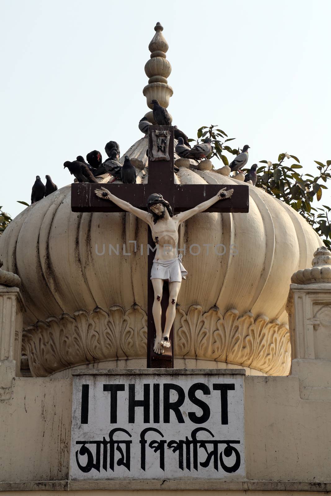Crucifix on top of the Nirmal Hriday, Home for the Sick and Dying Destitutes in Kolkata by atlas