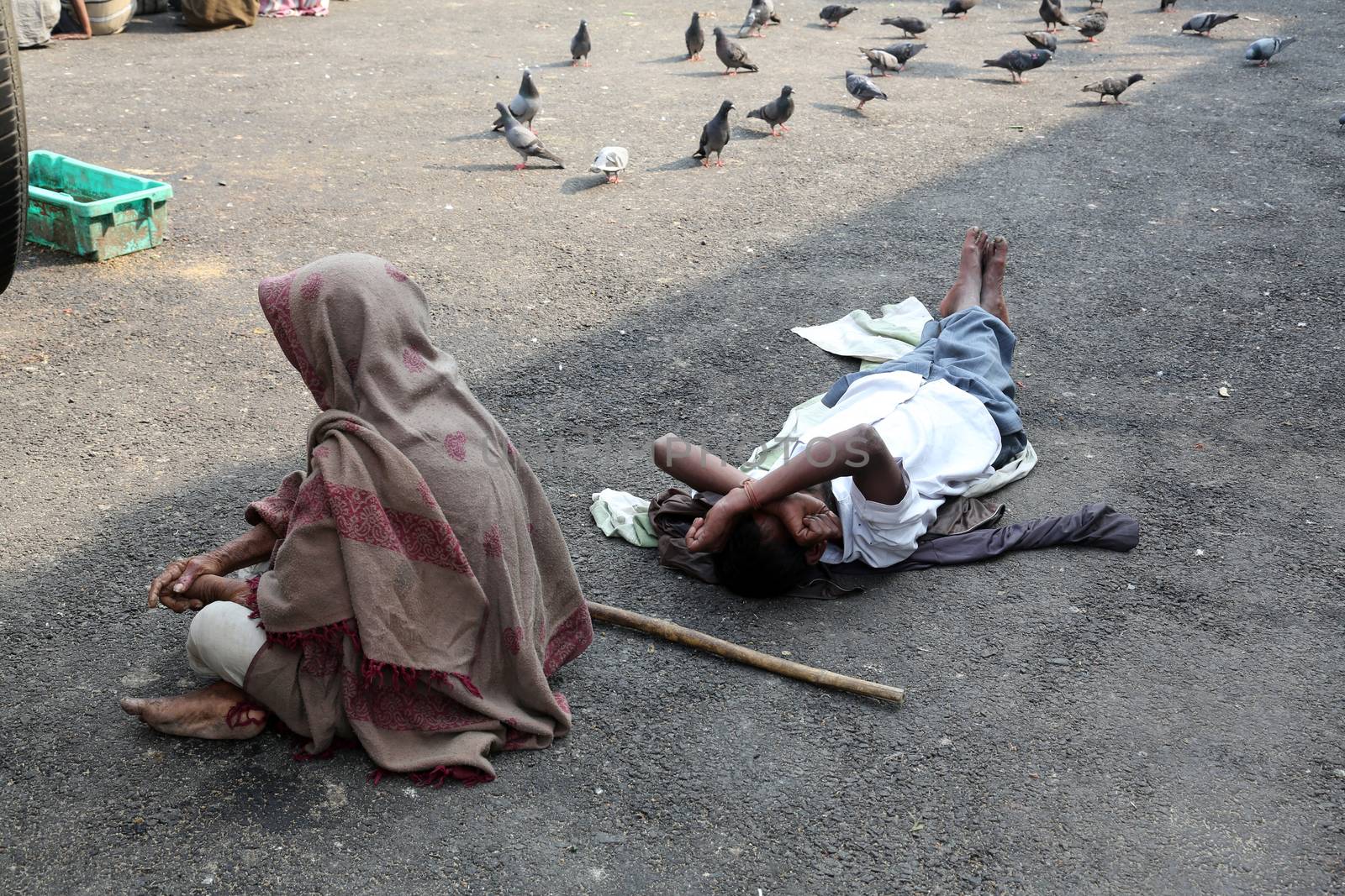 Beggars in front of Nirmal, Hriday, Home for the Sick and Dying Destitutes, one of the buildings established by the Mother Teresa and run by the Missionaries of Charity in Kolkata, India on February 10, 2014.