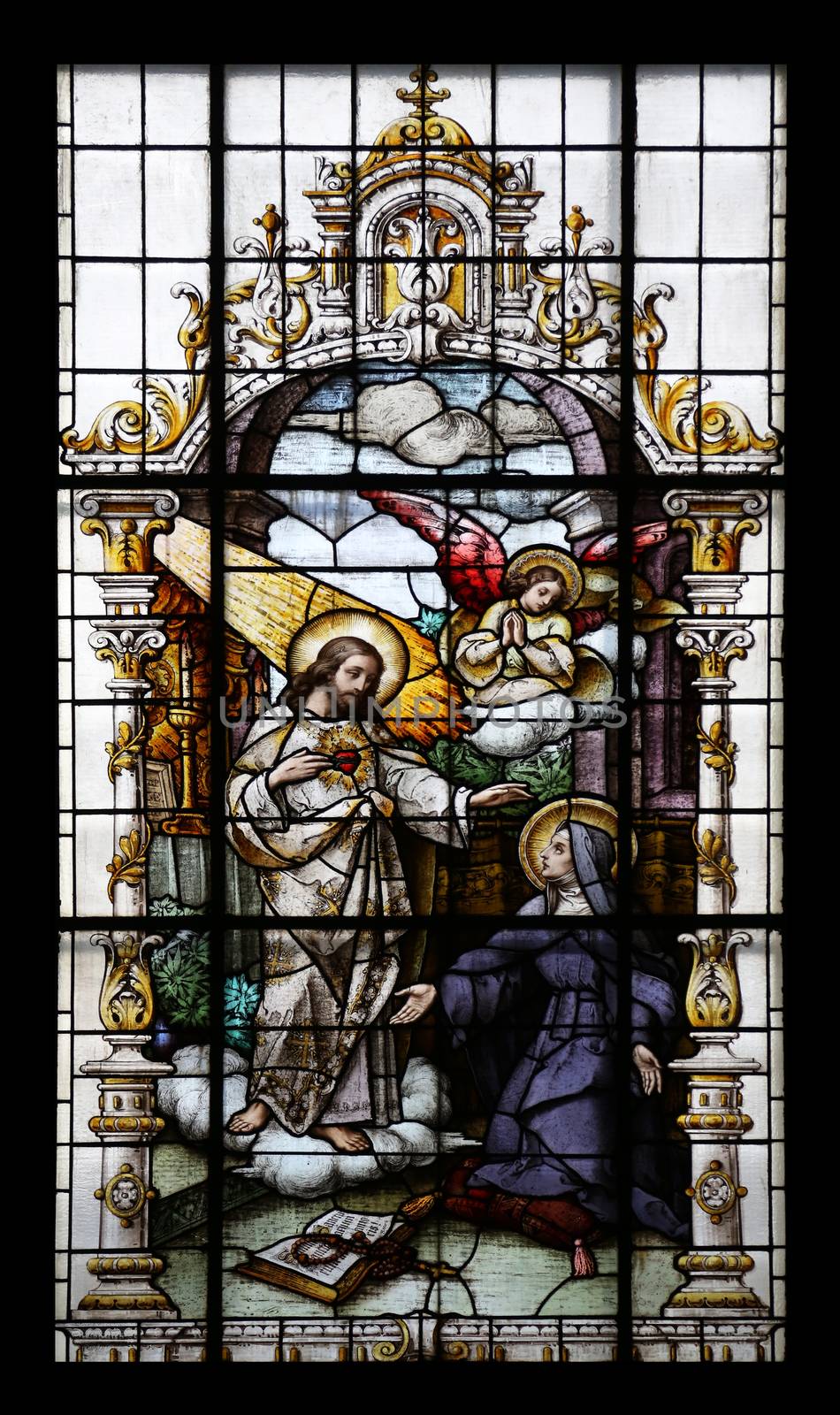 Jesus and Saint Margaret Mary Alacoque, stained glass window in the Basilica of the Sacred Heart of Jesus in Zagreb, Croatia on May 28, 2015
