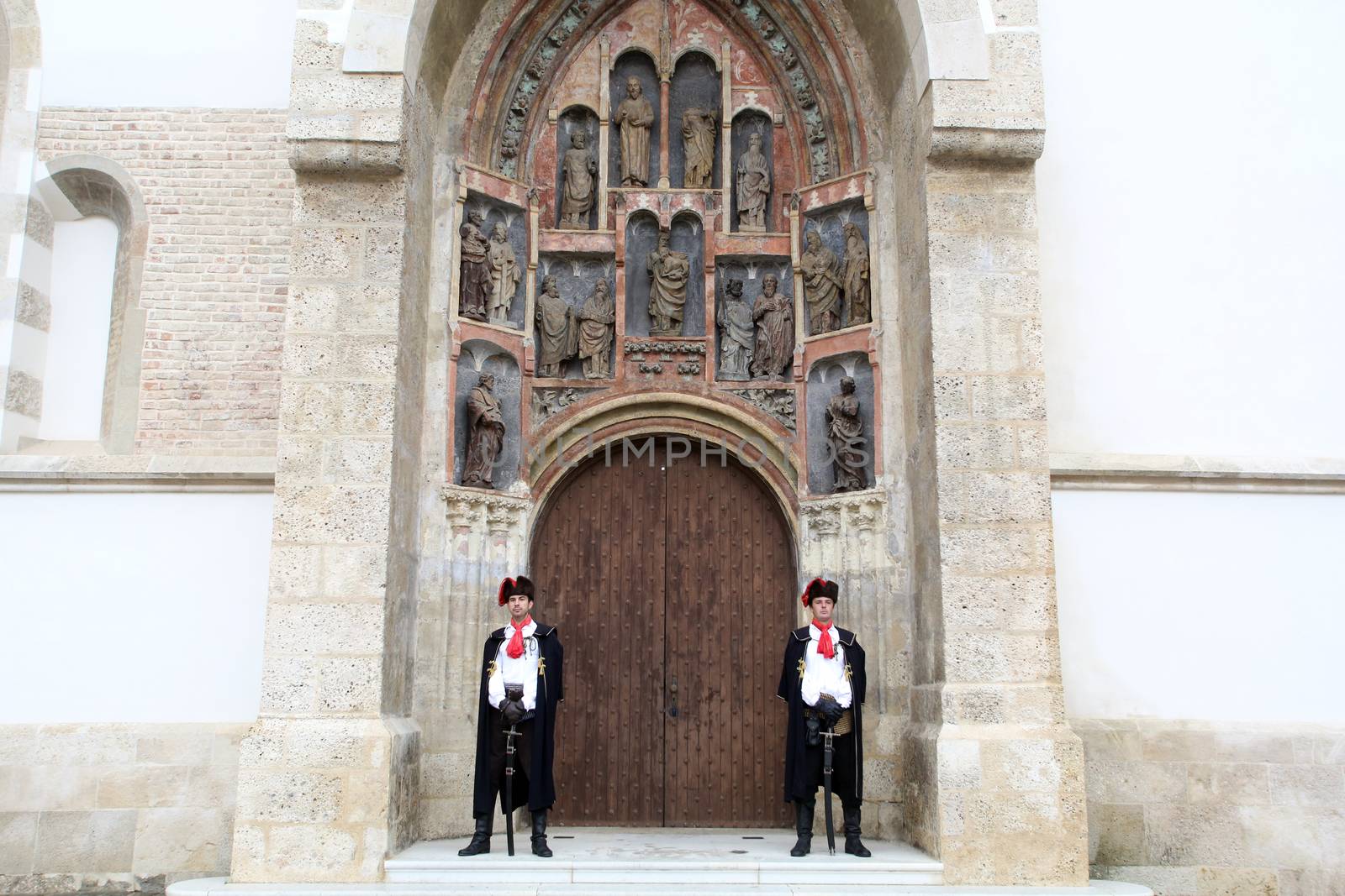 Guard of Honor of the Cravat Regiment on the south portal of the church of St. Mark in Zagreb, Croatia on September 20, 2014
