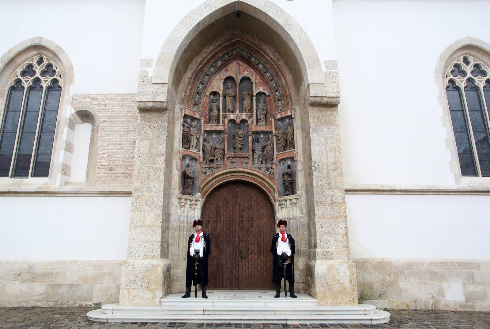 Guard of Honor of the Cravat Regiment on the south portal of the church of St. Mark in Zagreb, Croatia by atlas