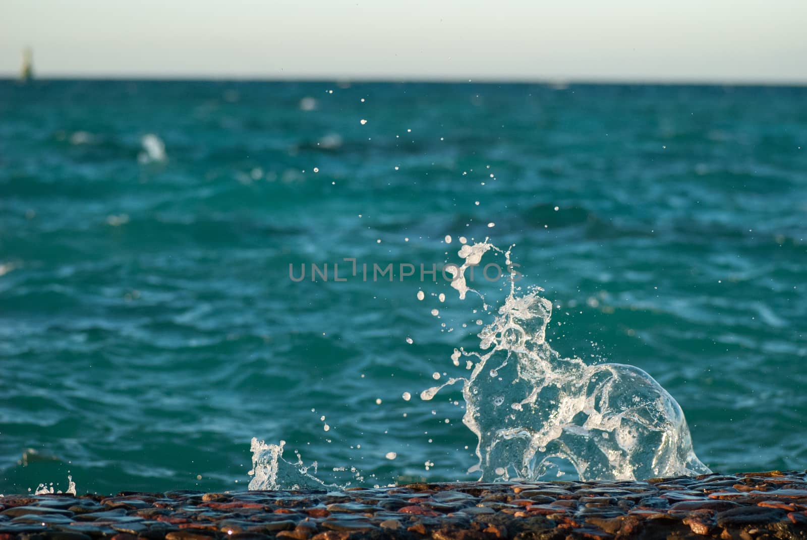 Photo closeup of beautiful clear turquoise sea ocean water surface with ripples and bright splash on seascape background, horizontal picture by skrotov