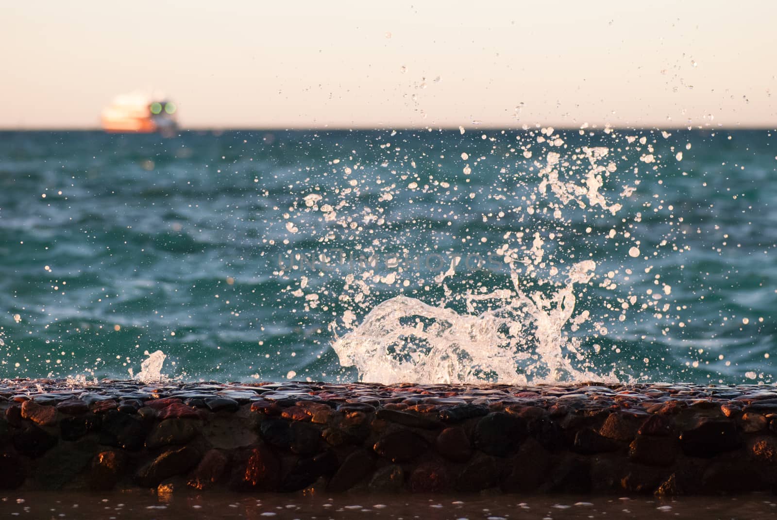 Photo closeup of beautiful clear turquoise sea ocean water surface with ripples and bright splash on seascape background, horizontal picture.