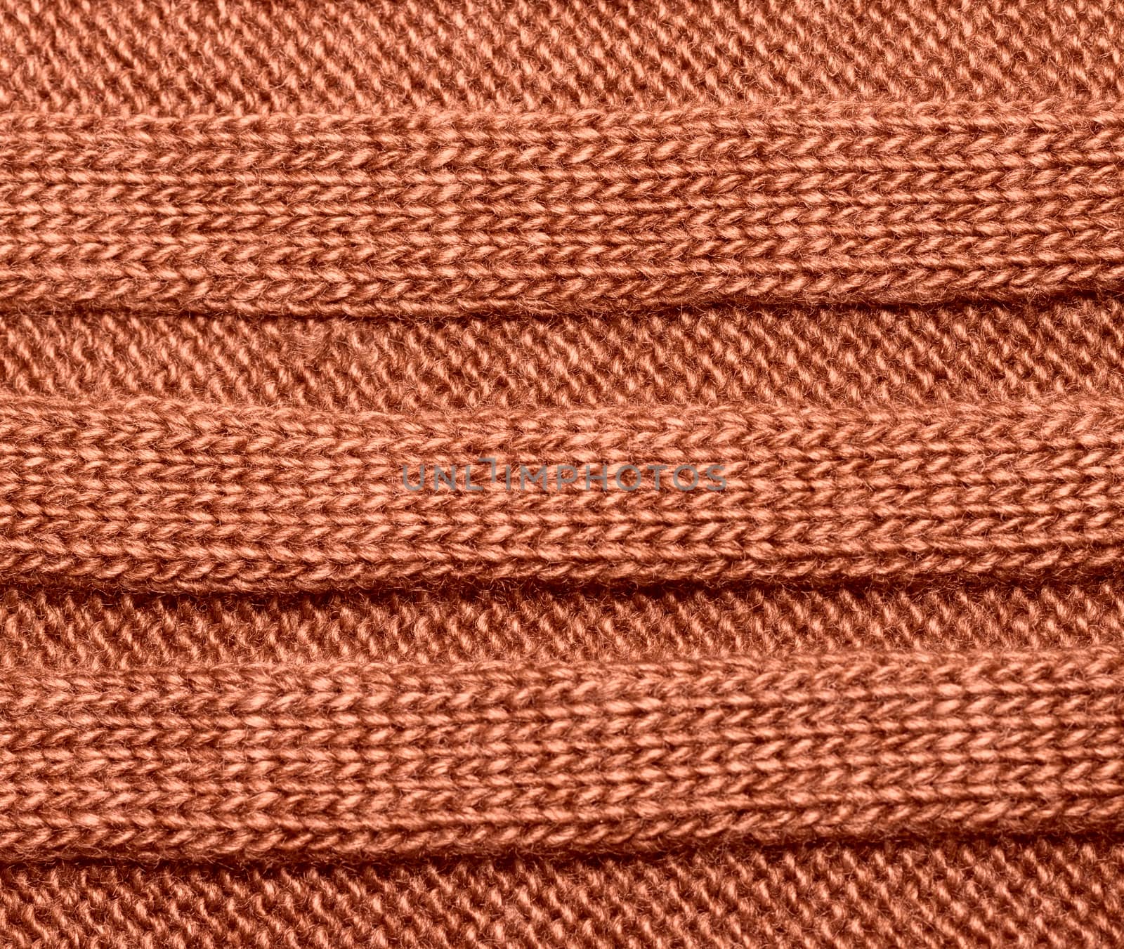 Brown ribbed knit wool like texture, textured fabrics knitted jersey, wool as a background pattern, upholstery