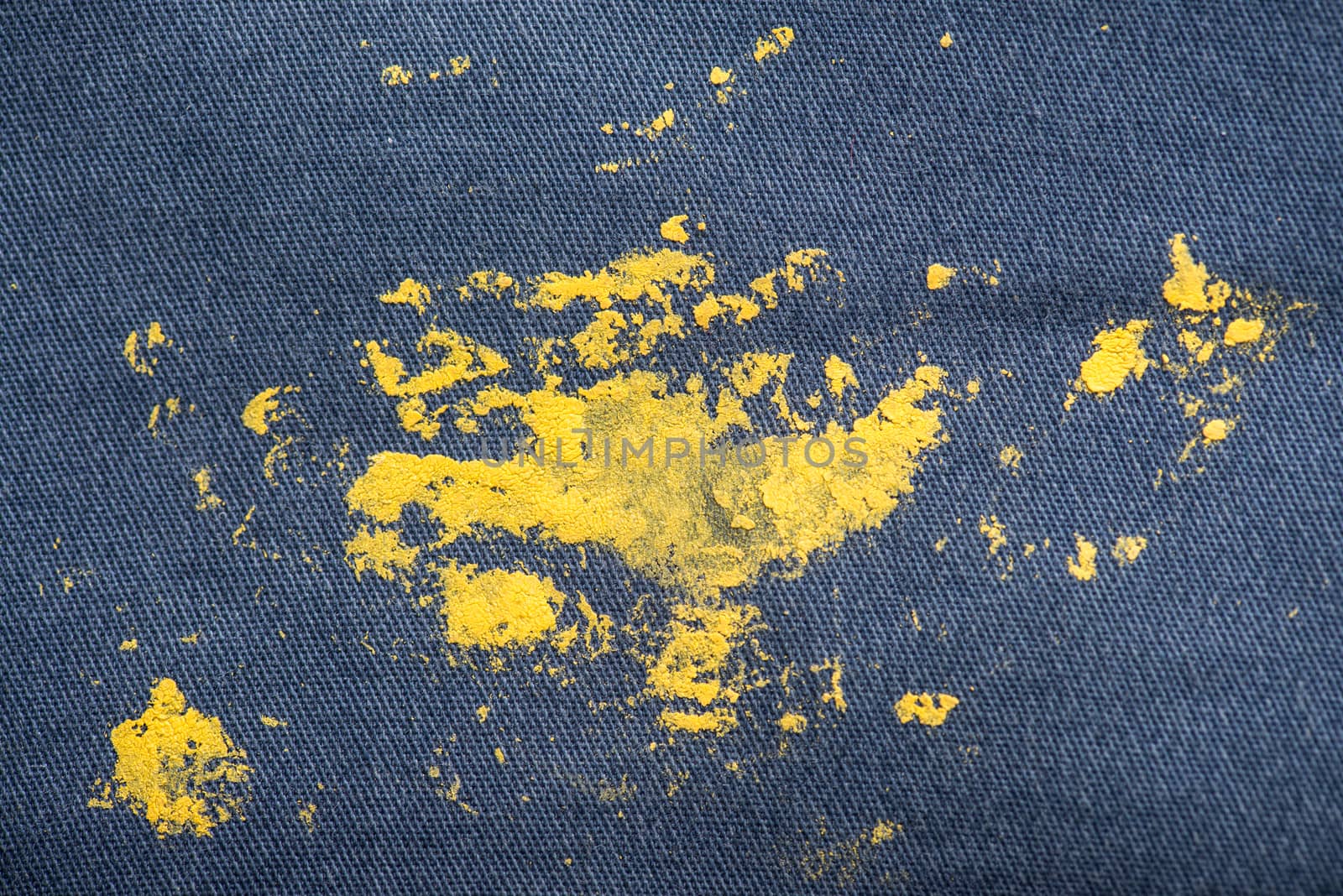 Blue Jeans and sneakers stained with yellow paint. by skrotov