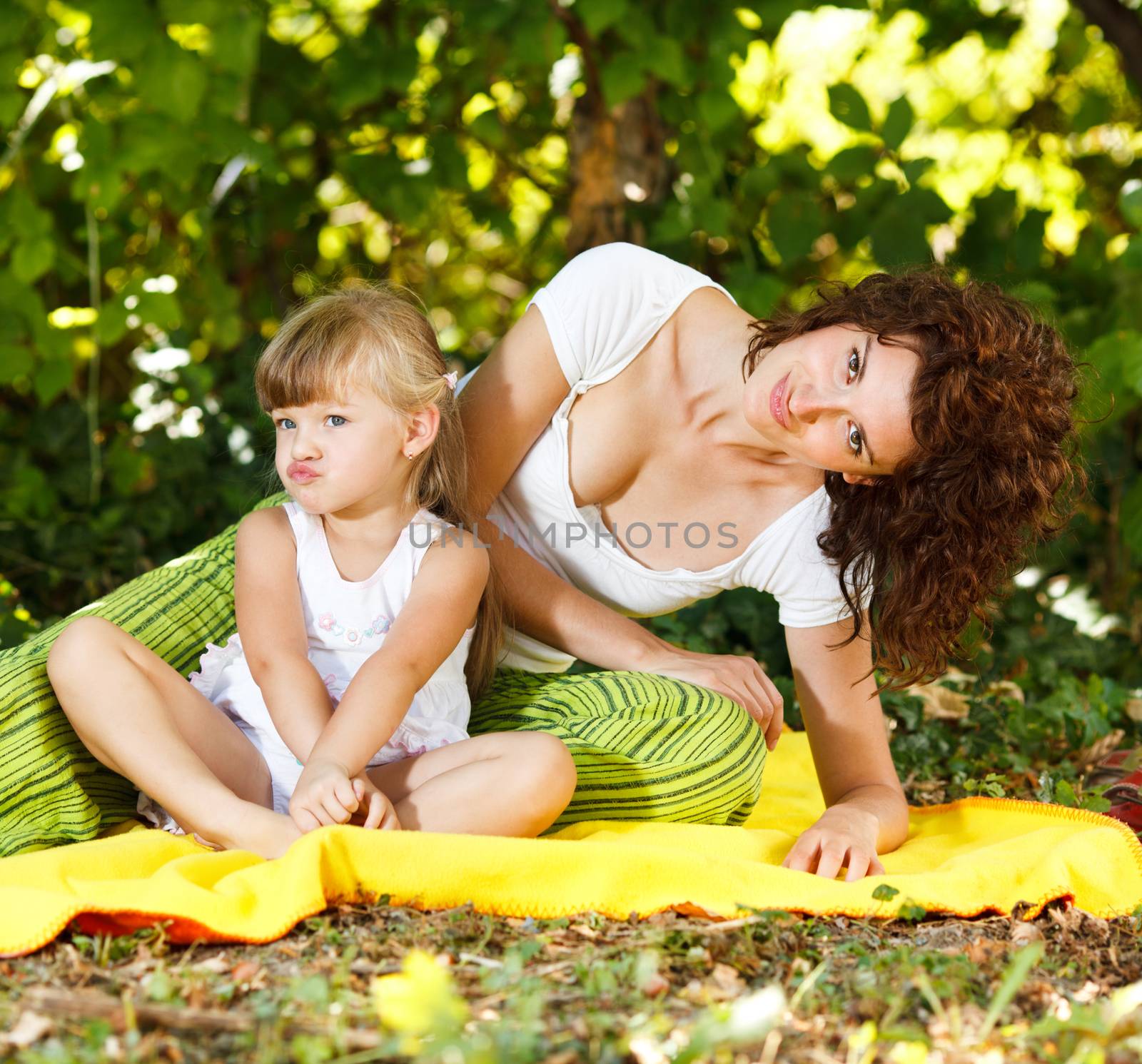 Beautiful mother and daughter making a funny face