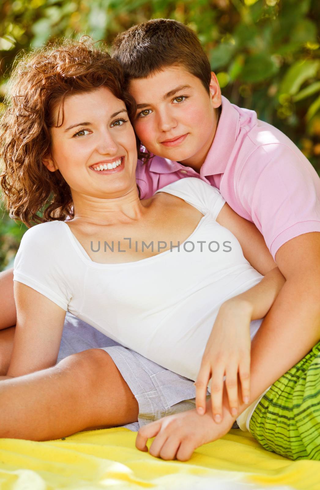 Beautiful brother and sister relaxing in nature