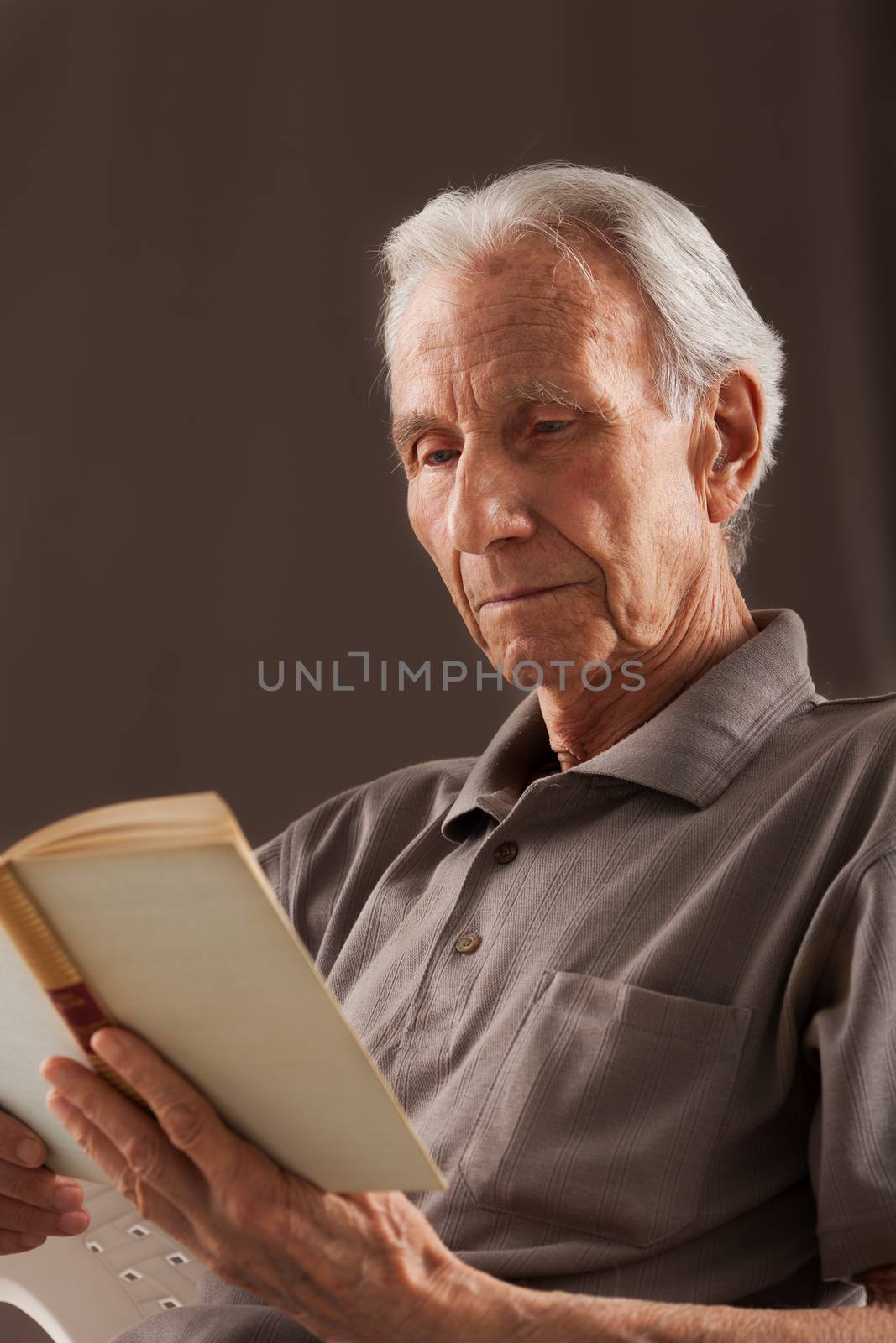 Elderly senior men sitting and reading book