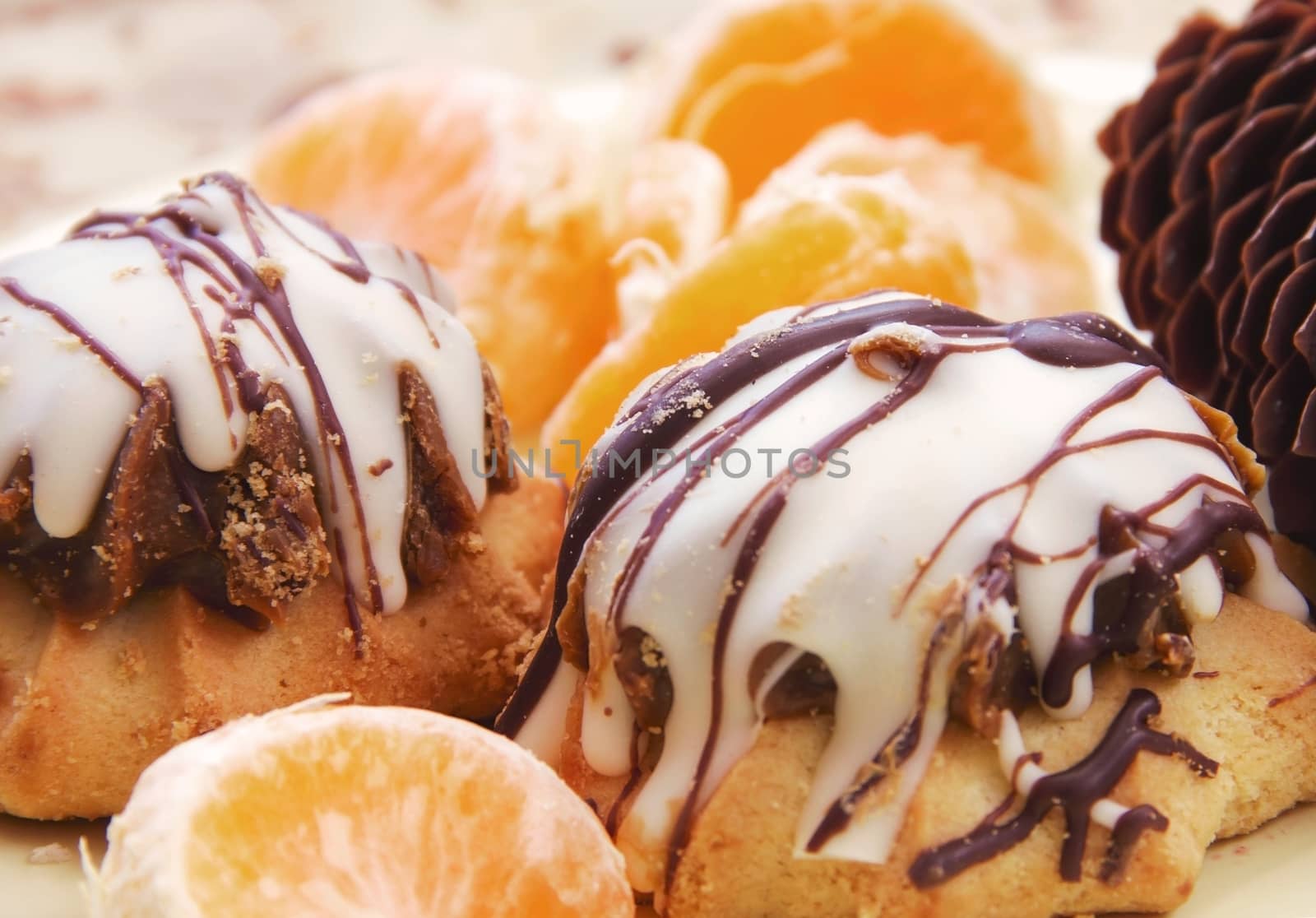 cake and cookies on a plate with mandarin tea with dessert winter festive dessert and fruit soft focus