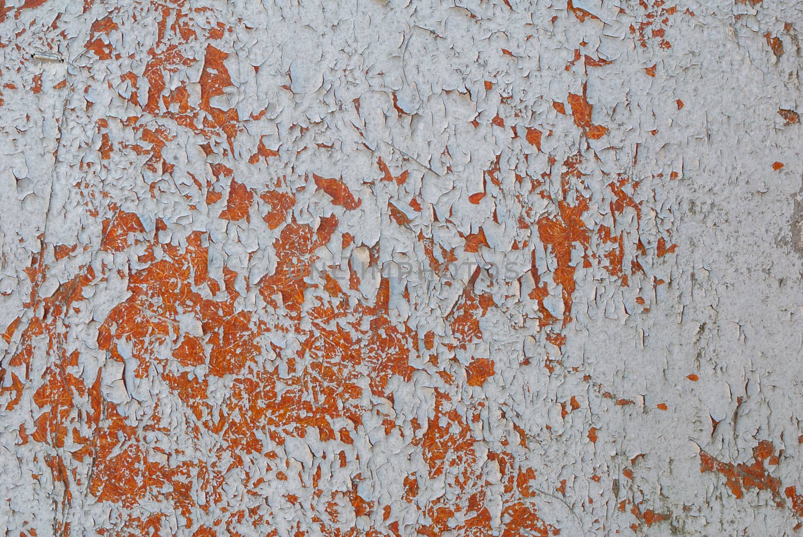 texture of surface with remnants of old paint that has dried and cracked under the influence of weather