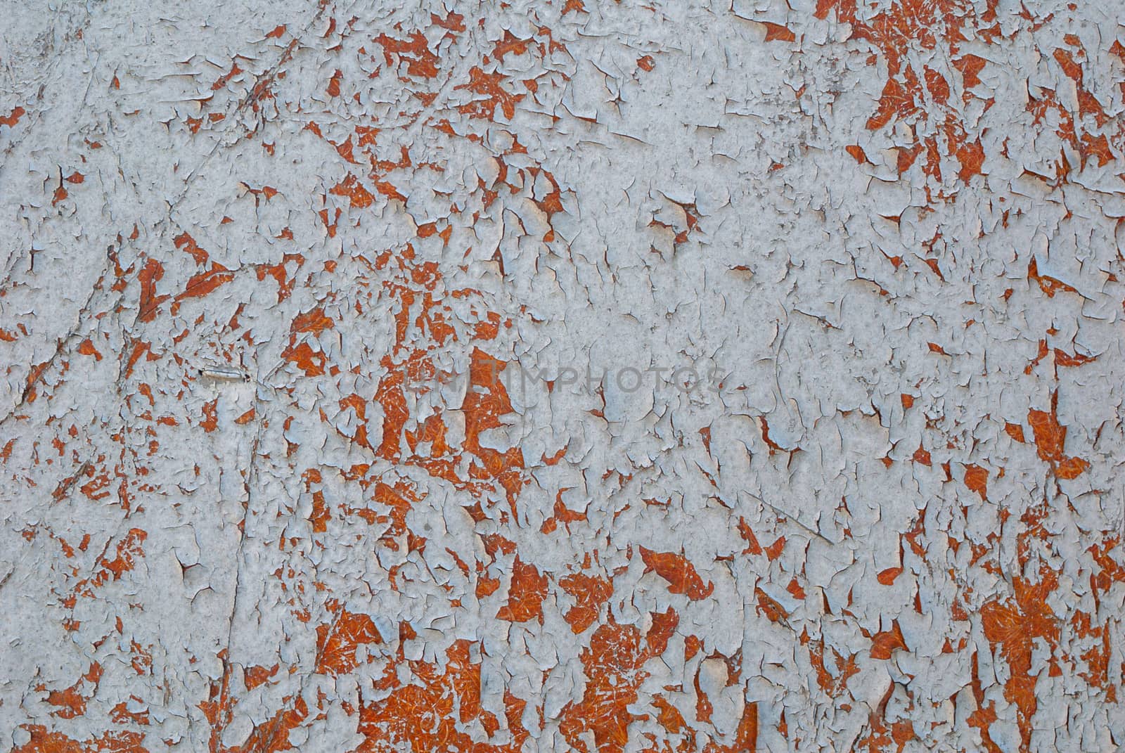 texture of surface with remnants of old paint that has dried and cracked under the influence of weather