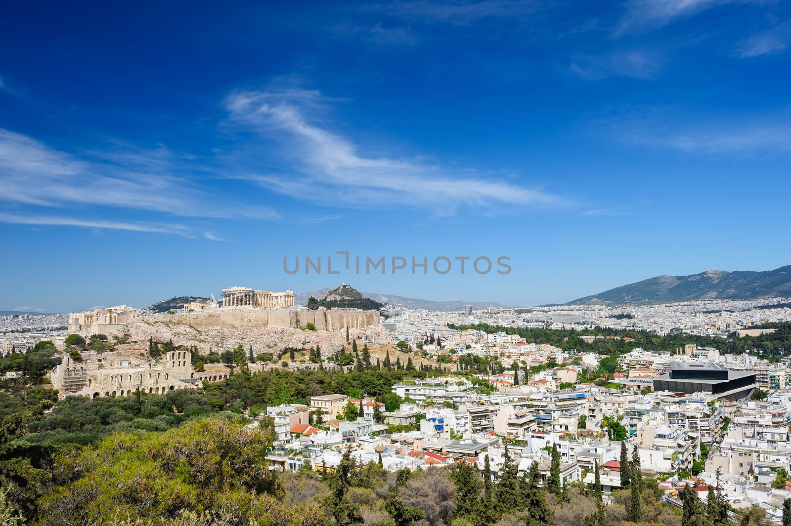 Ancient Acropolis hill and Athens panorama. Greece, copyspace at sky.