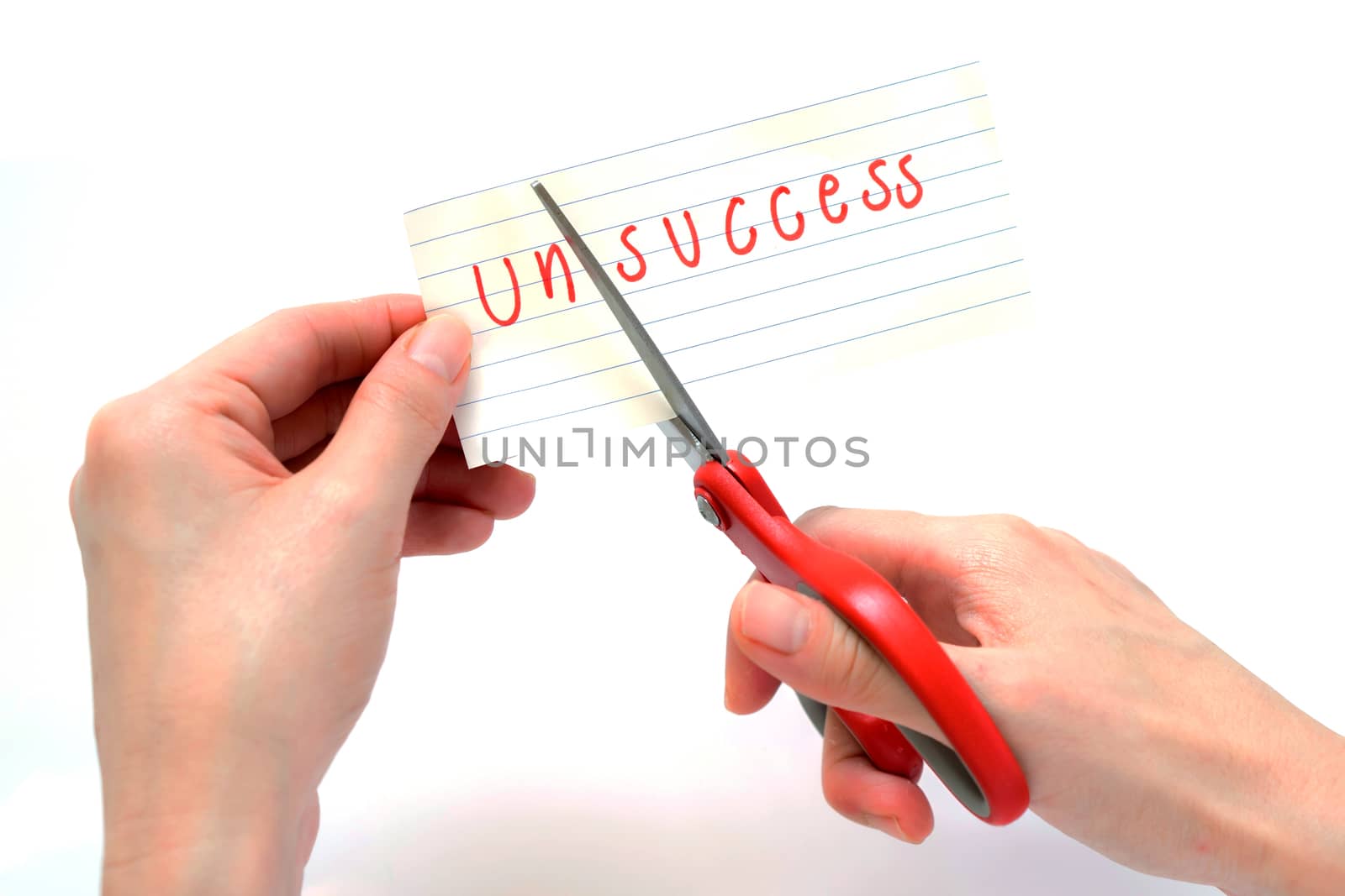 Female using scissors to remove the word unsuccess to read success concept for self belief, positive attitude and motivation
