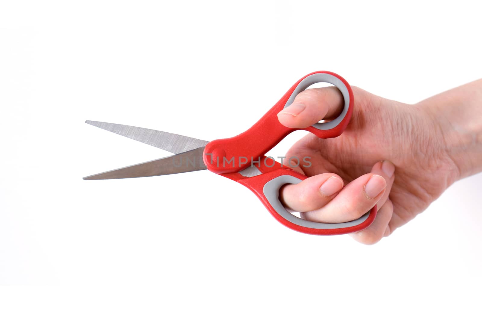 Female hand holding scissors, isolated on white background