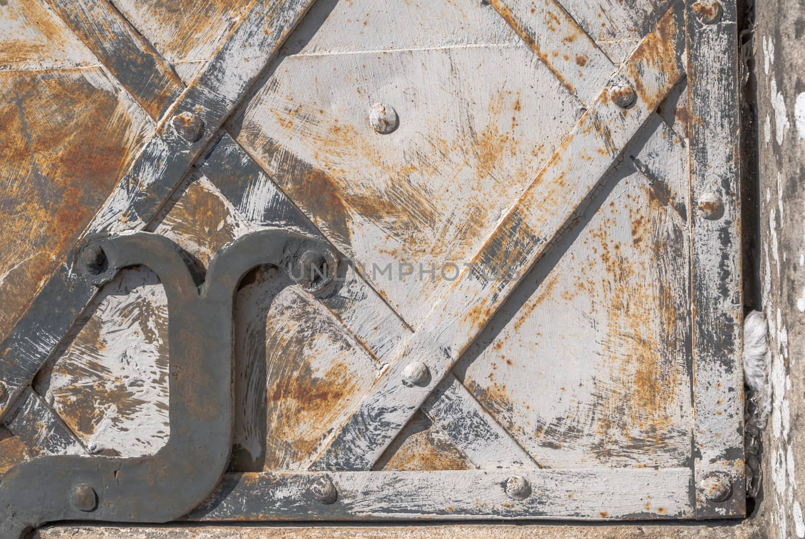 rusty iron surface covered with old chipped paint, which has long been influenced by different climatic conditions