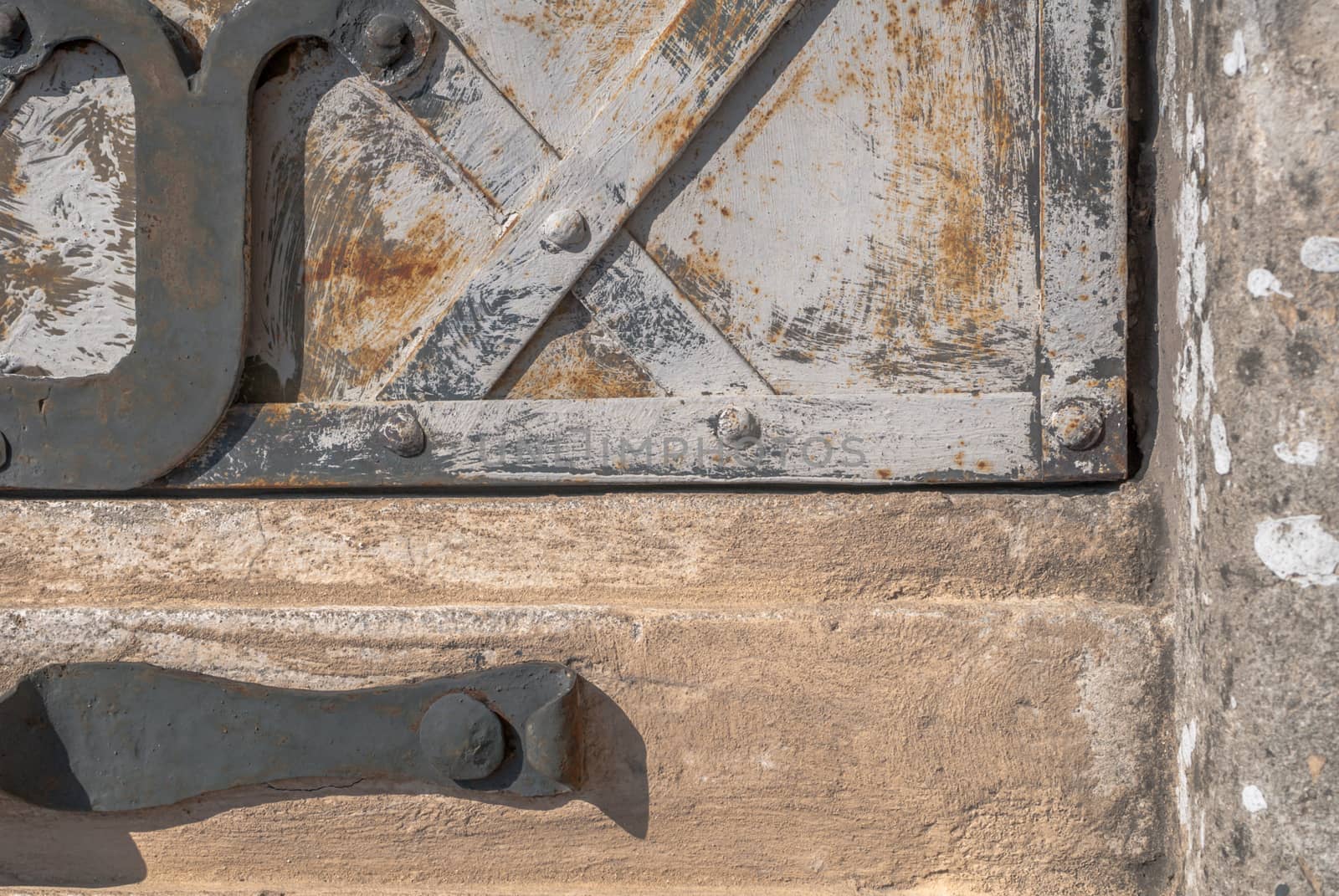 fragment of an iron surface is covered with paint, which has long been under the influence of different climatic conditions