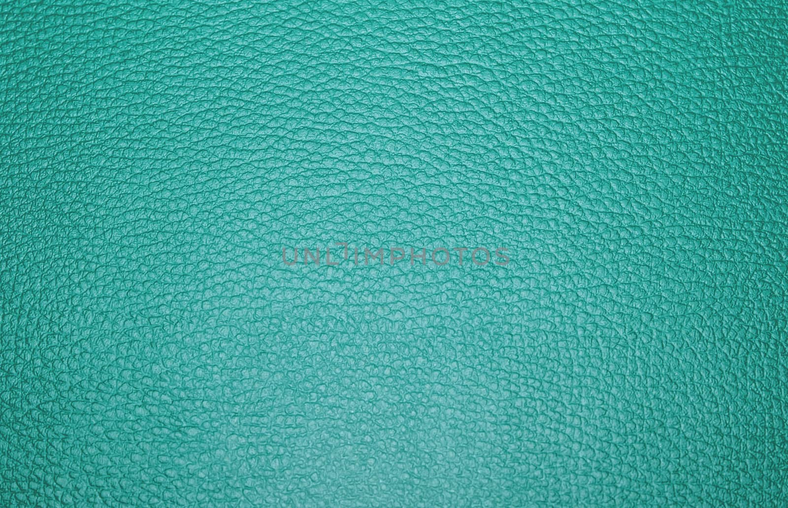 Texture colored leatherette green, for design and upholstery for decoration and fashion, for the background and tukstur