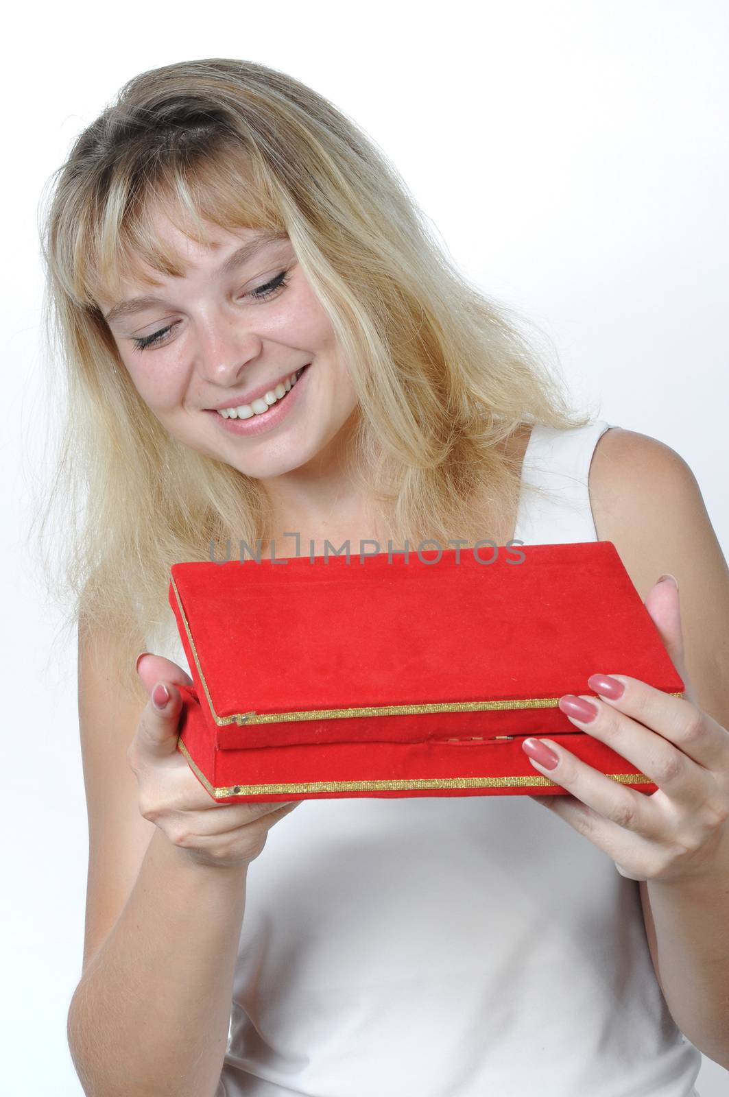  Beautiful woman astonished with the surprise inside of the red box