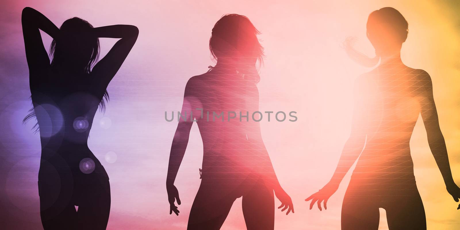 Silhouette of Women Posing at the Beach Together