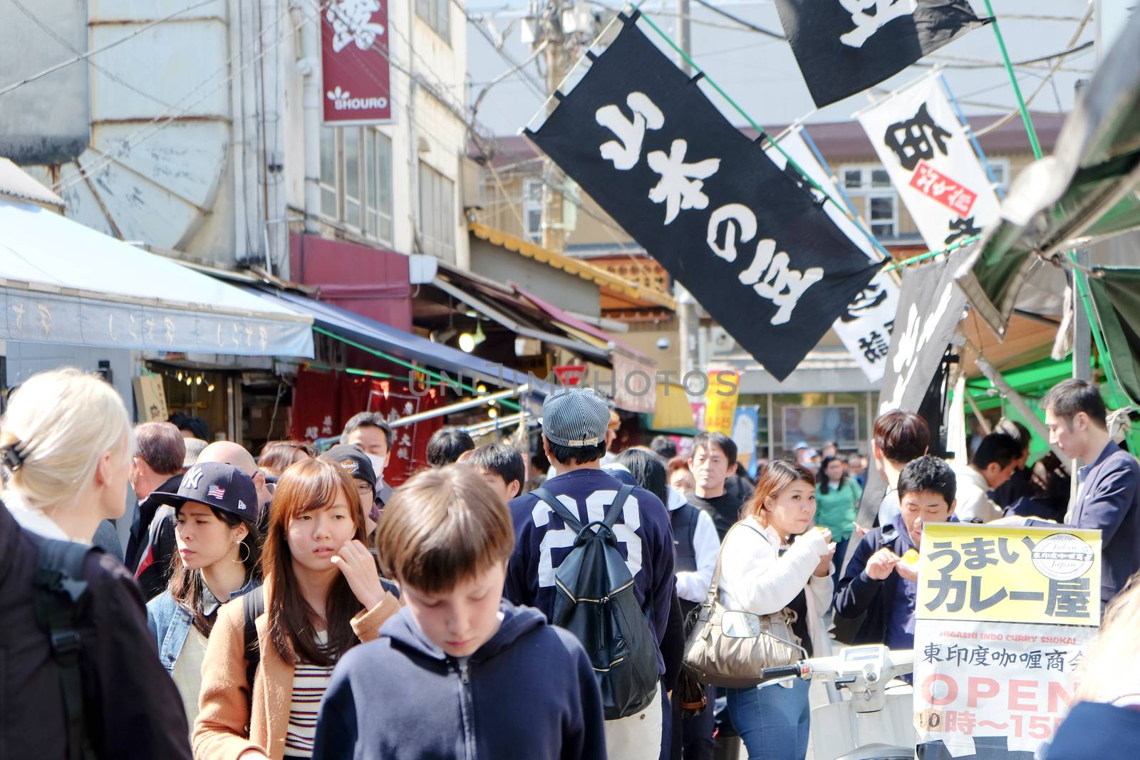 Tourists Walking in the Tsukiji Market by ponsulak