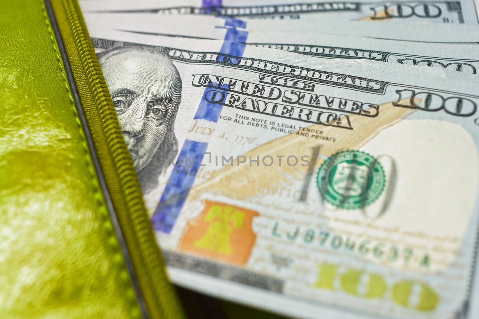 dollar notes in a wallet, hundred-dollar bills are in a bag, to spend money in your wallet close
