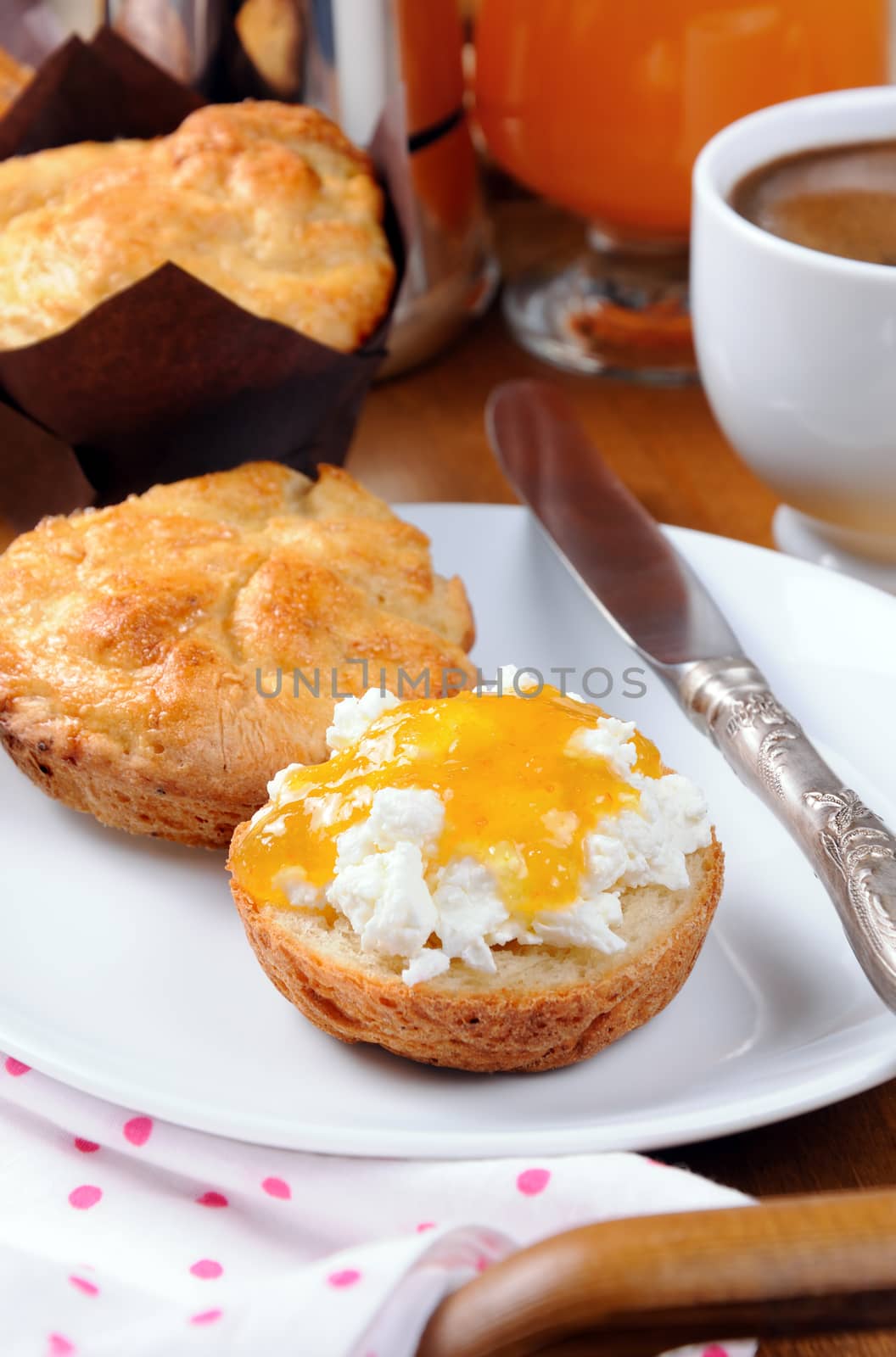 Breakfast of bun with cheese cottage,  orange  jam on the tray