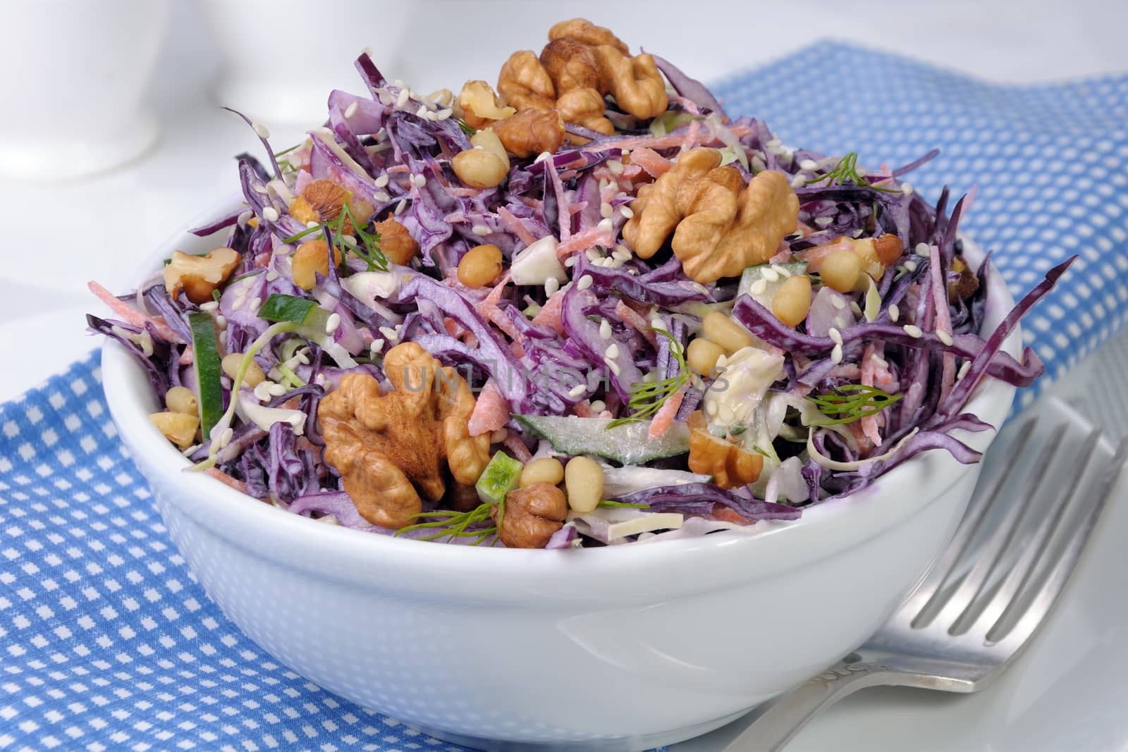 salad of shredded cabbage with nuts in milk sauce