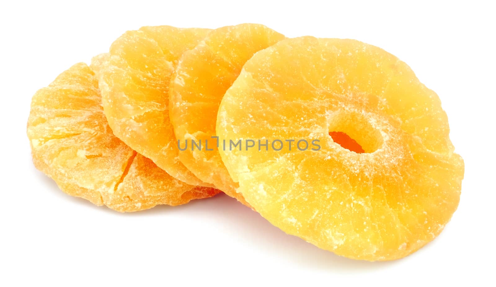 Dried ?andied pineapple rings isolated on white background.