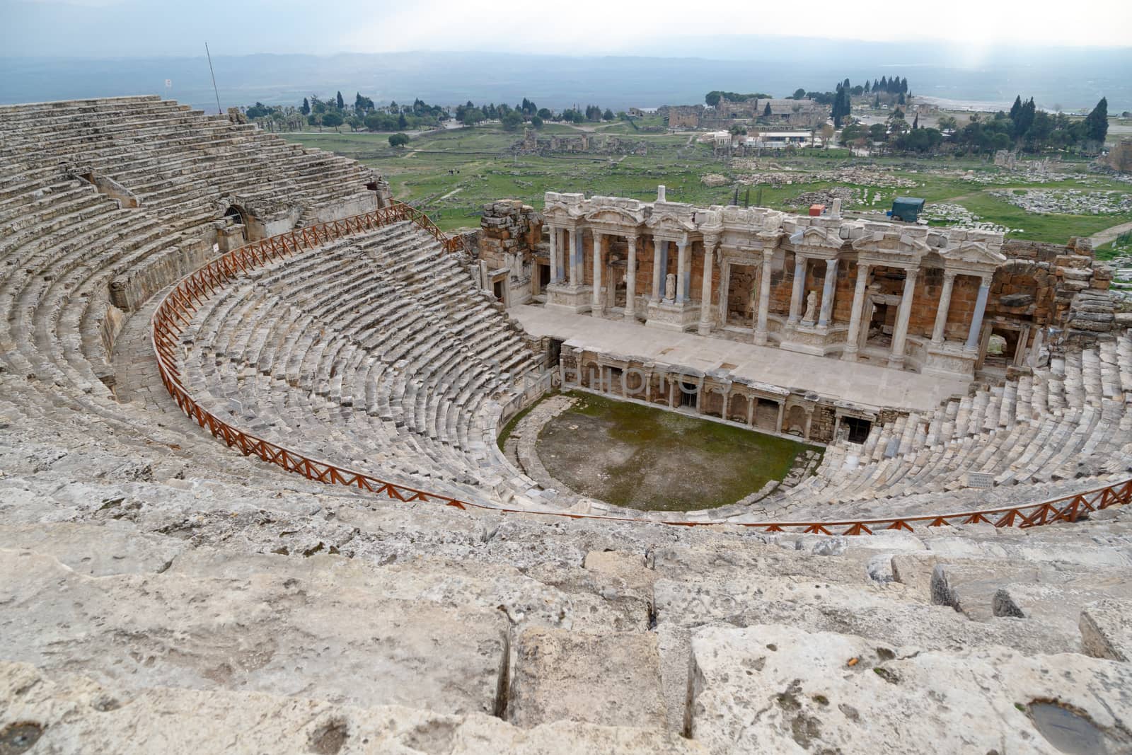 View of Hyerapolis Ancient City with a historical stone amphitheater.