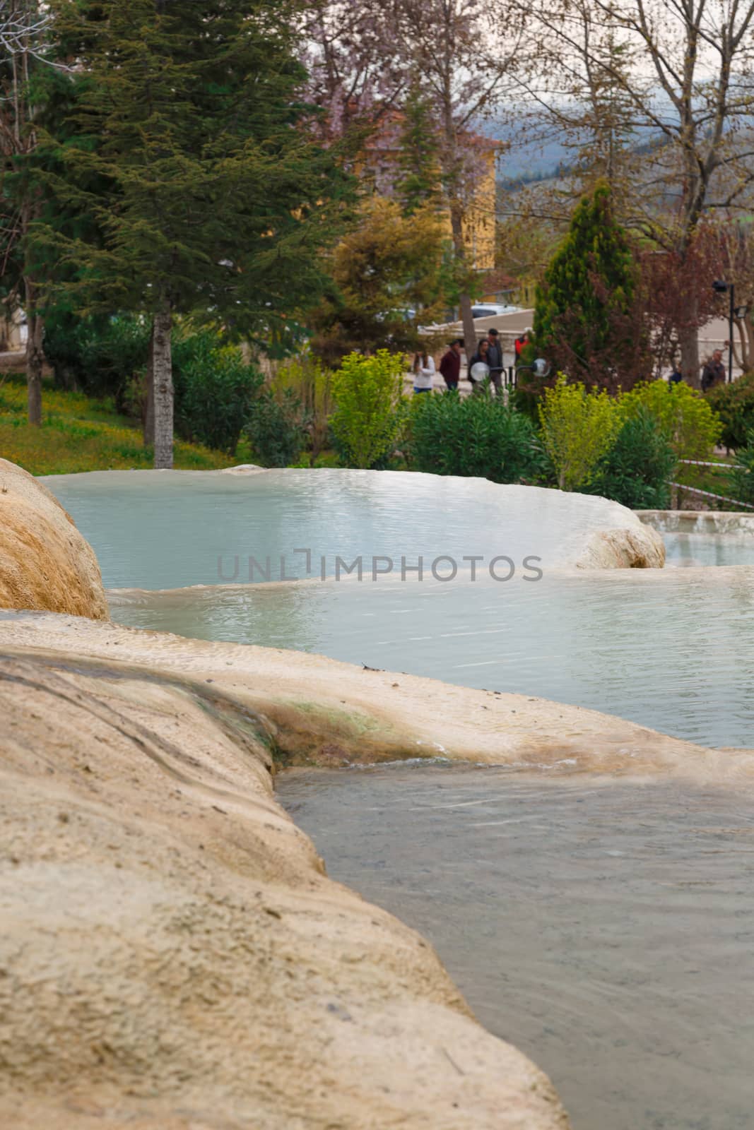 View of natural geographical formations in Pamukkale area in Turkey with travertine pools.