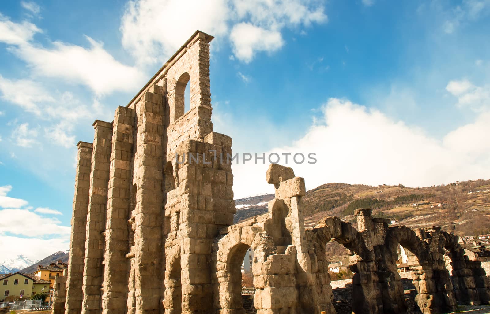 The main feature of the Roman theater of Aosta is a monumental facade. This is the only part of the architectural complex with its southern side, which survives to this day.