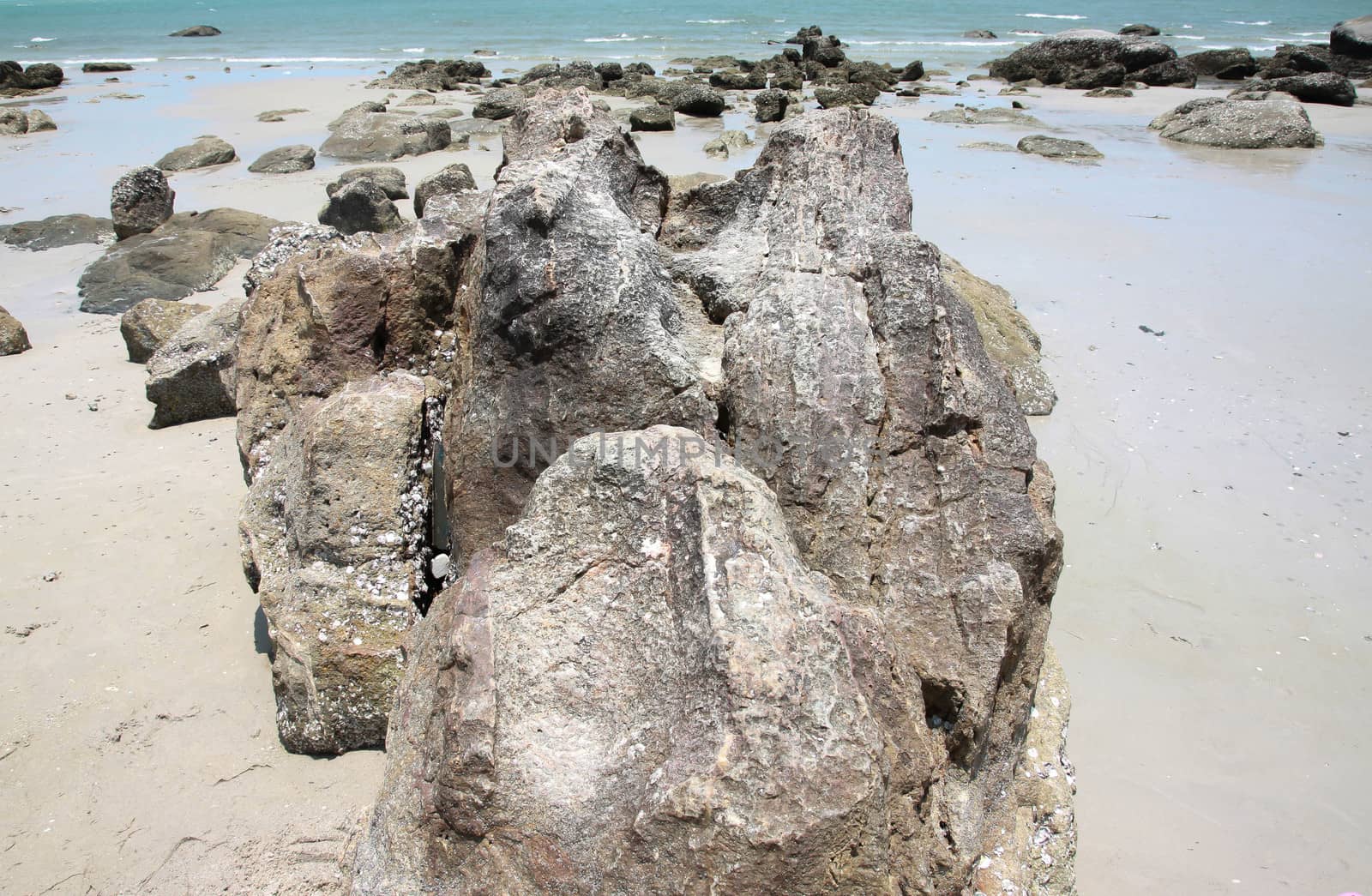 Big rocks on beach, by primzrider