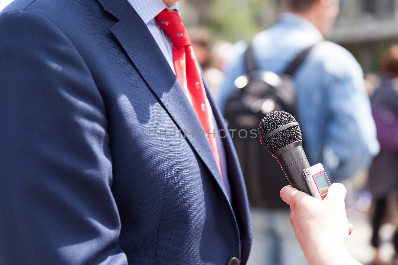 Media interview with politician or businessman. Press conference.