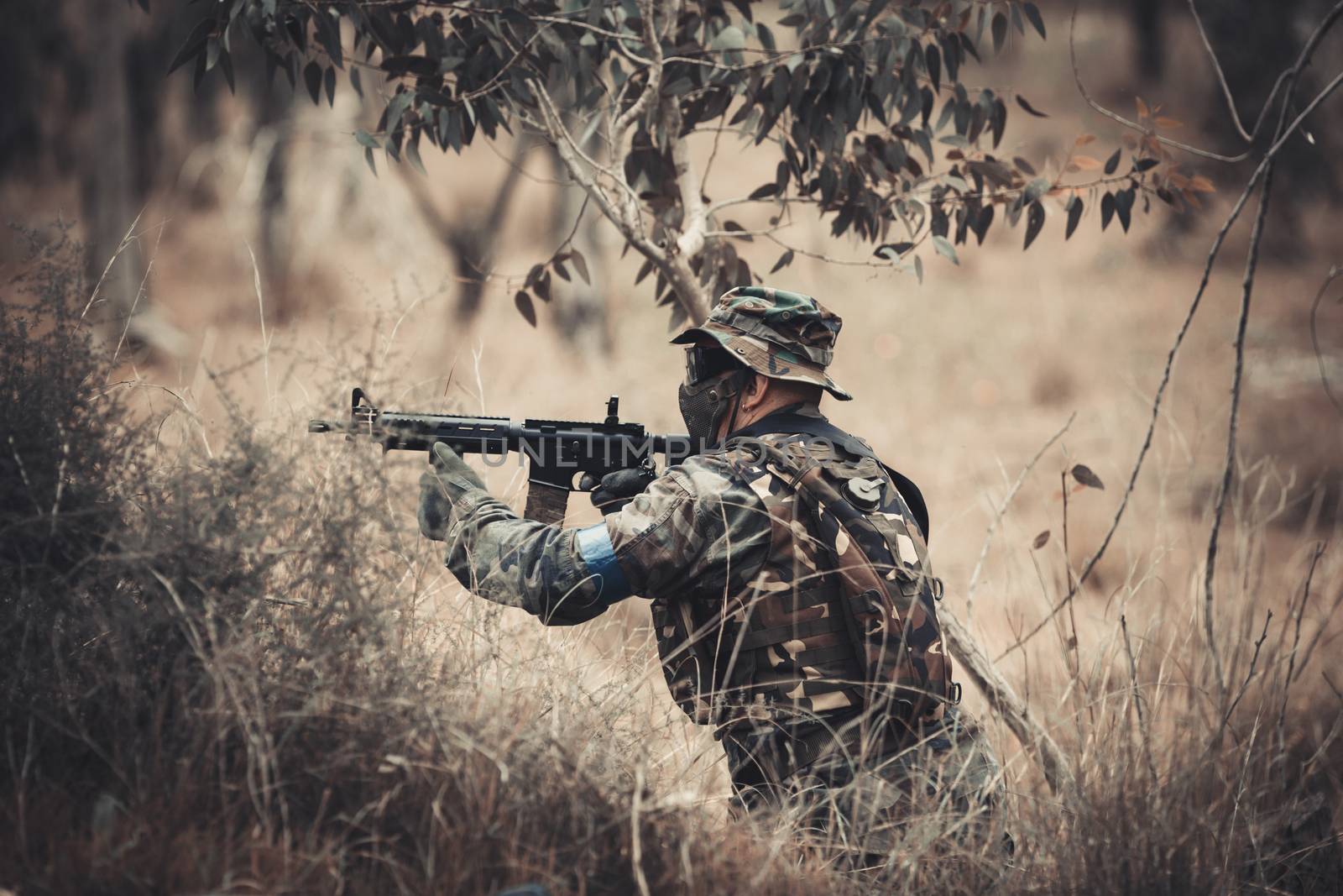 men in military uniform with weapon on a mission