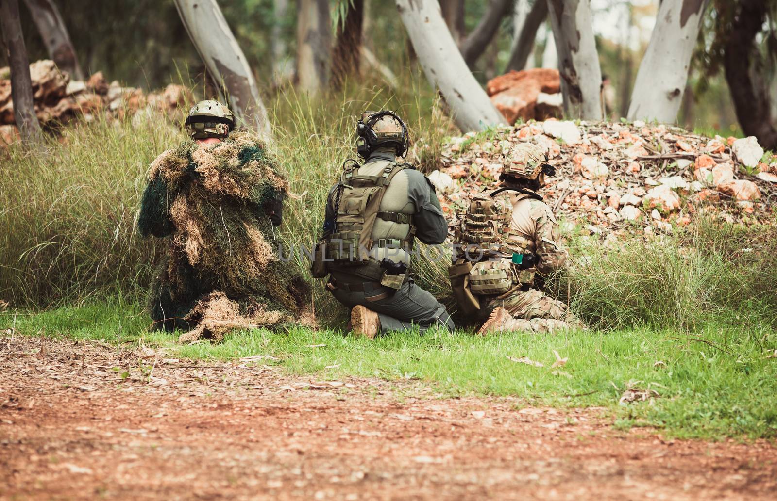 mens in military uniform with weapon on a mission