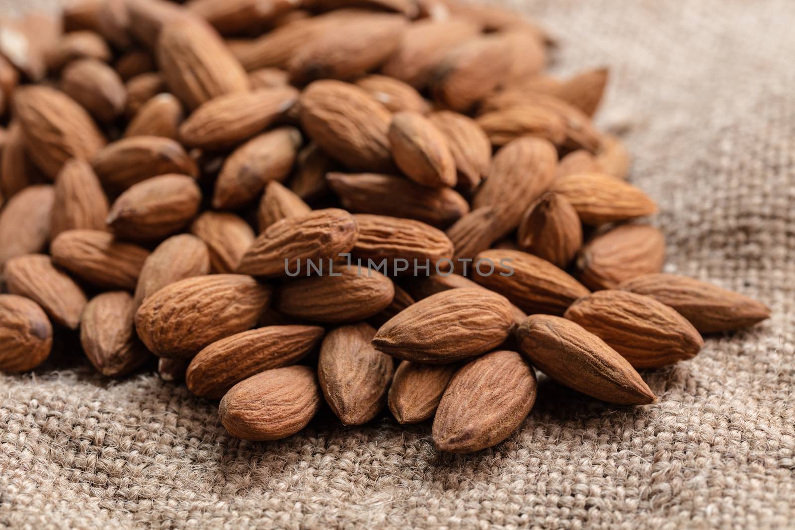 the natural almonds closeup on vintage background