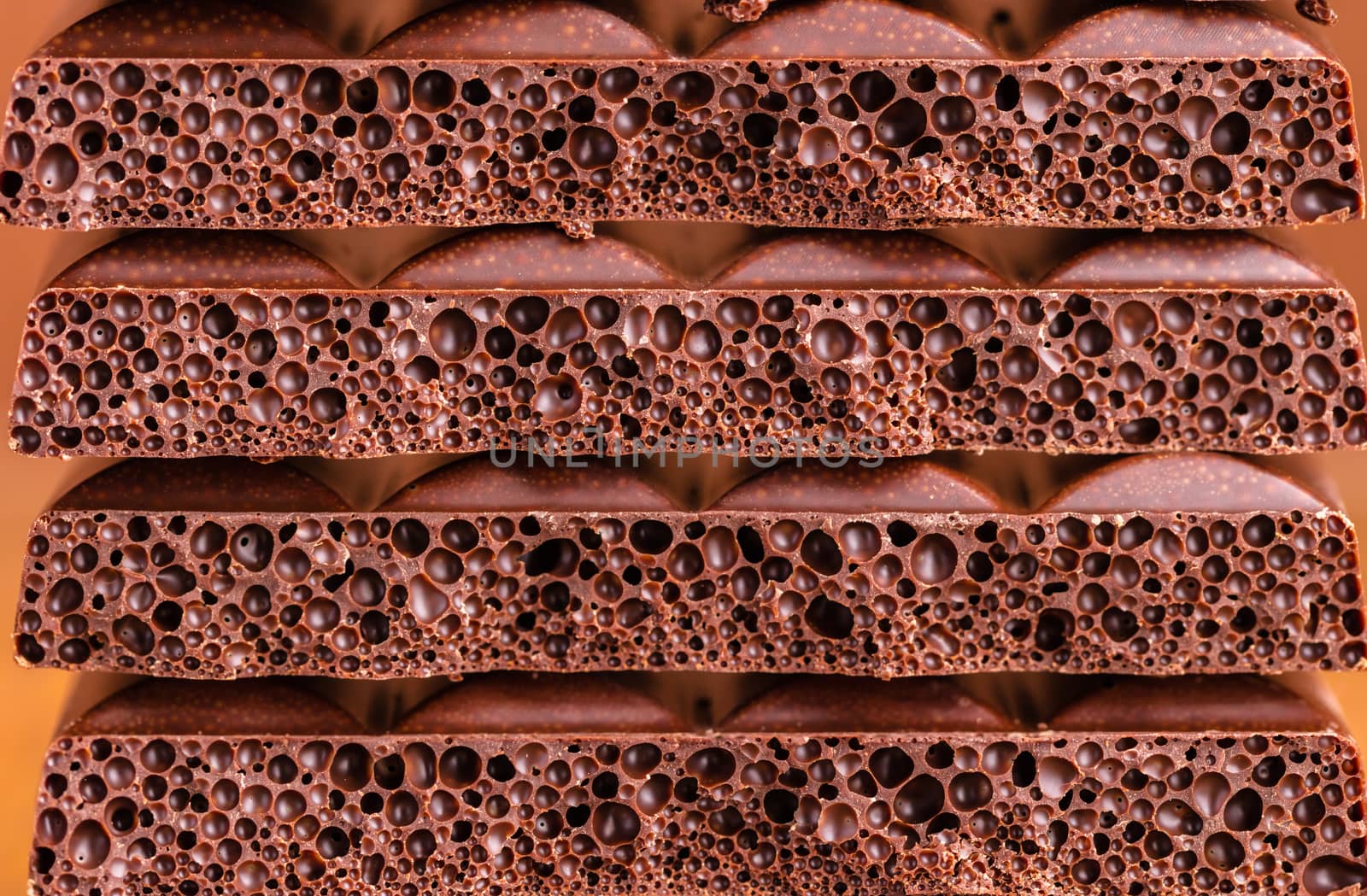 background texture of milk porous chocolate closeup