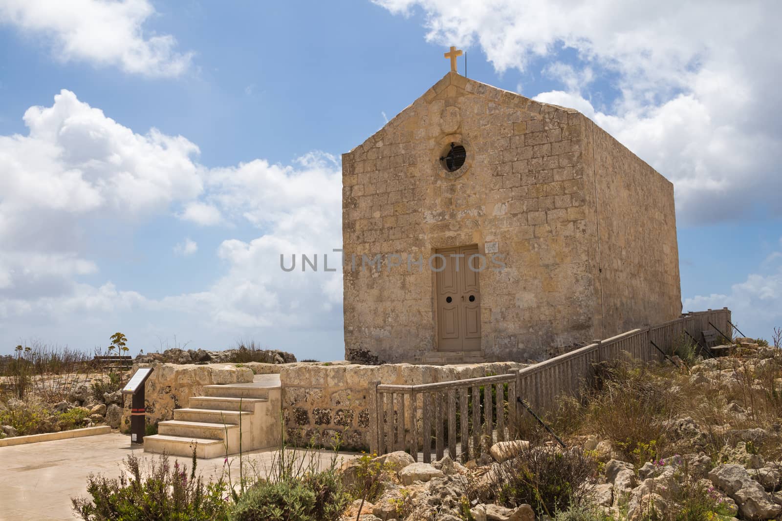 St. Mary Magdalene Chapel was rebuilt on the cliff edge in the seventeenth century. Located in Dingli at the mediterranean island Malta. Intense clouds.